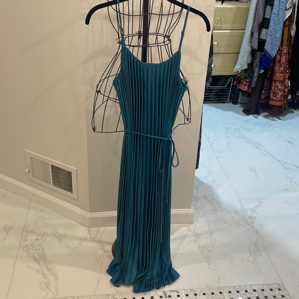 Never worn, beautiful pleated teal dress.